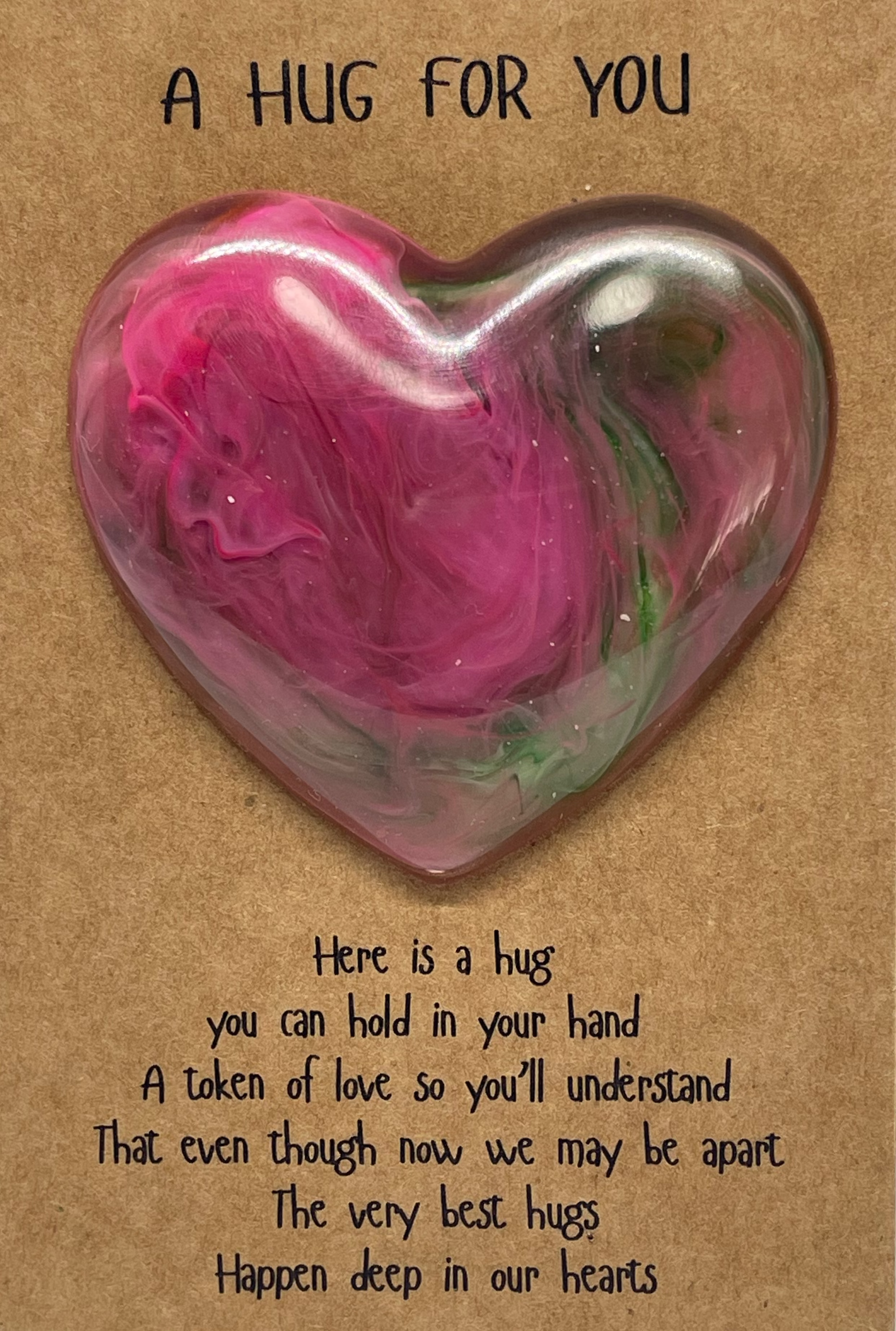 Heart-shaped Heart Hug on a card with text, displayed on a white background