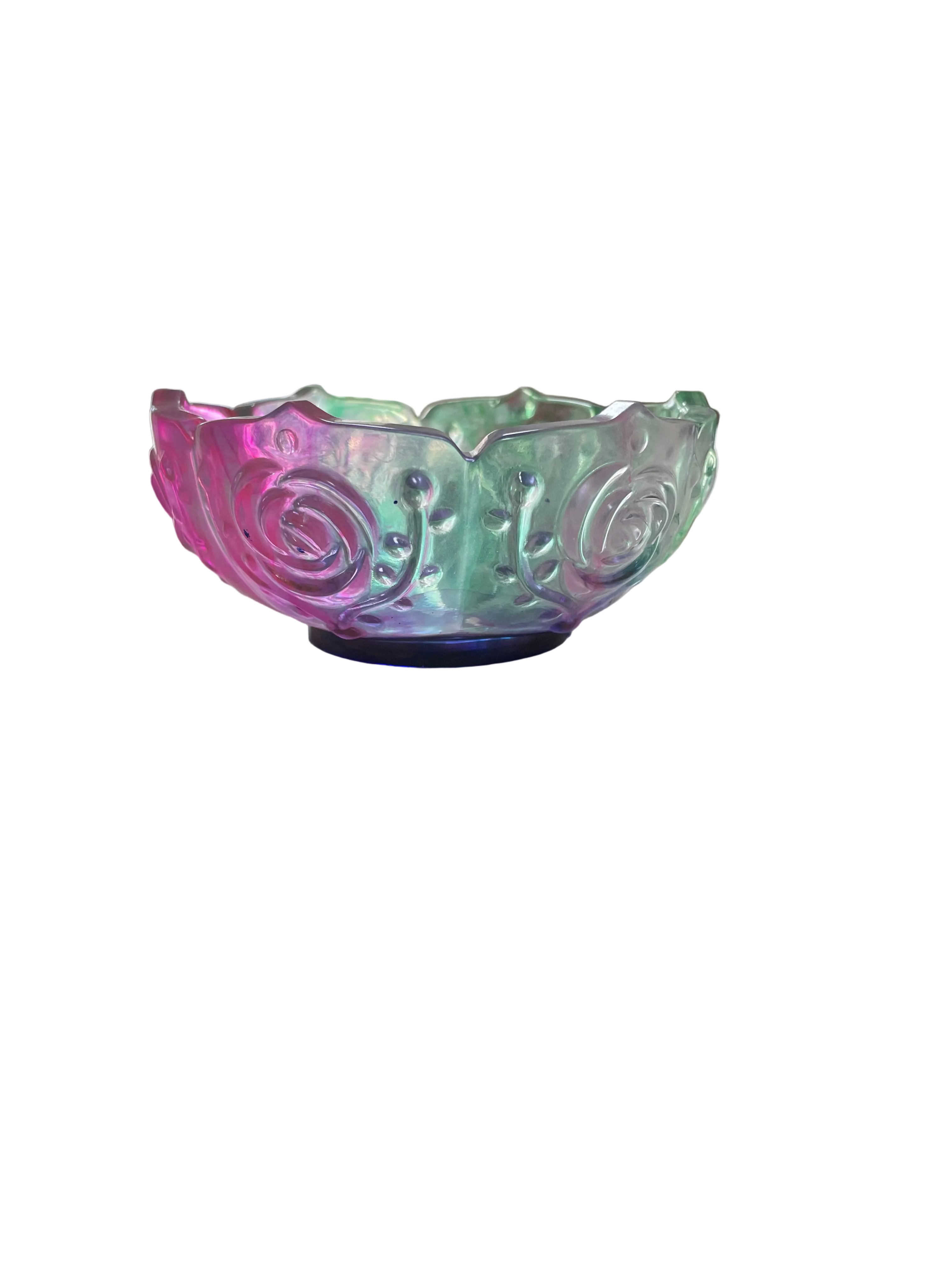 Decorative resin bowl on a surface with a blurred kitchen background