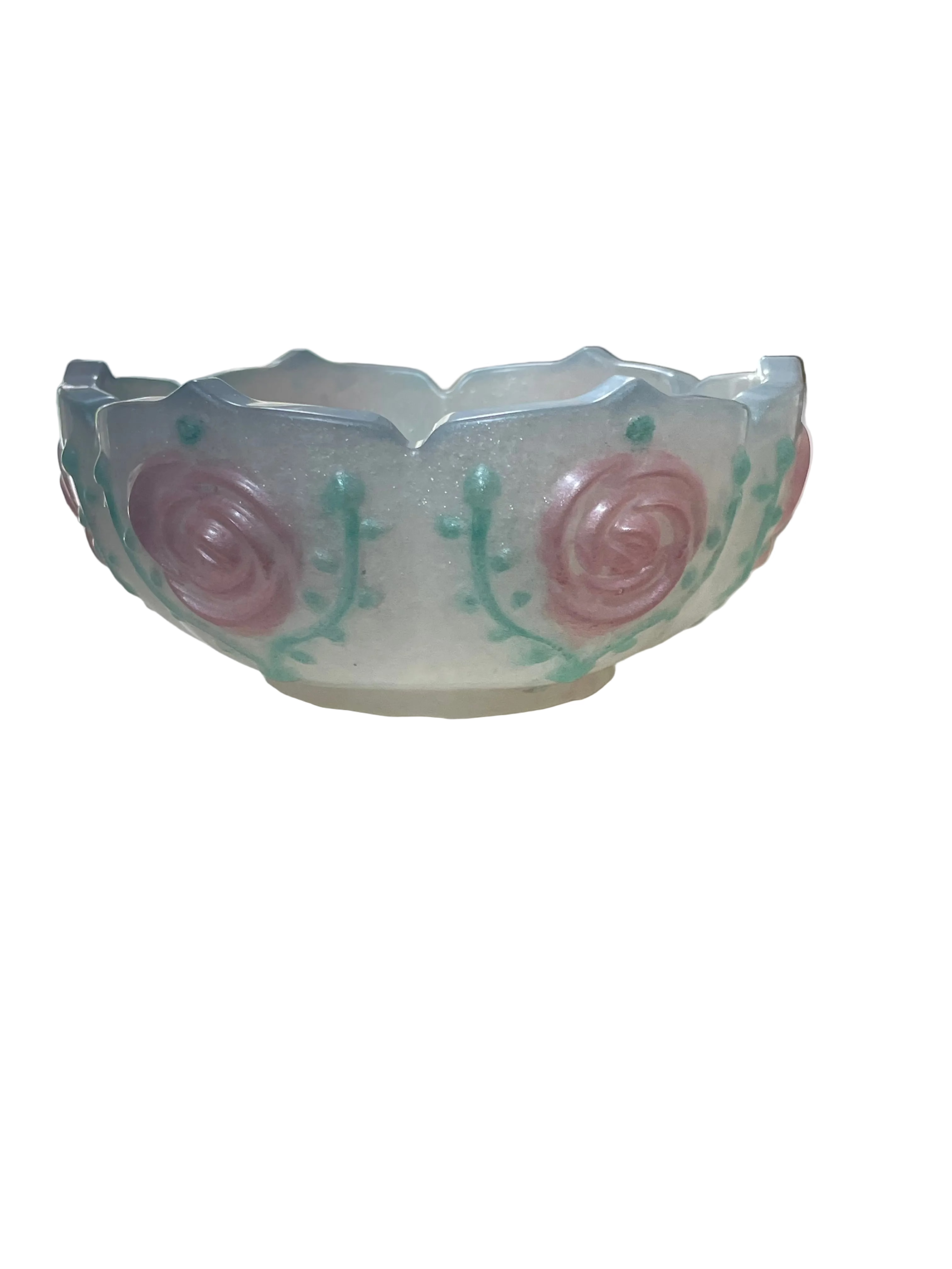 Decorative resin bowl with pink roses on a white surface