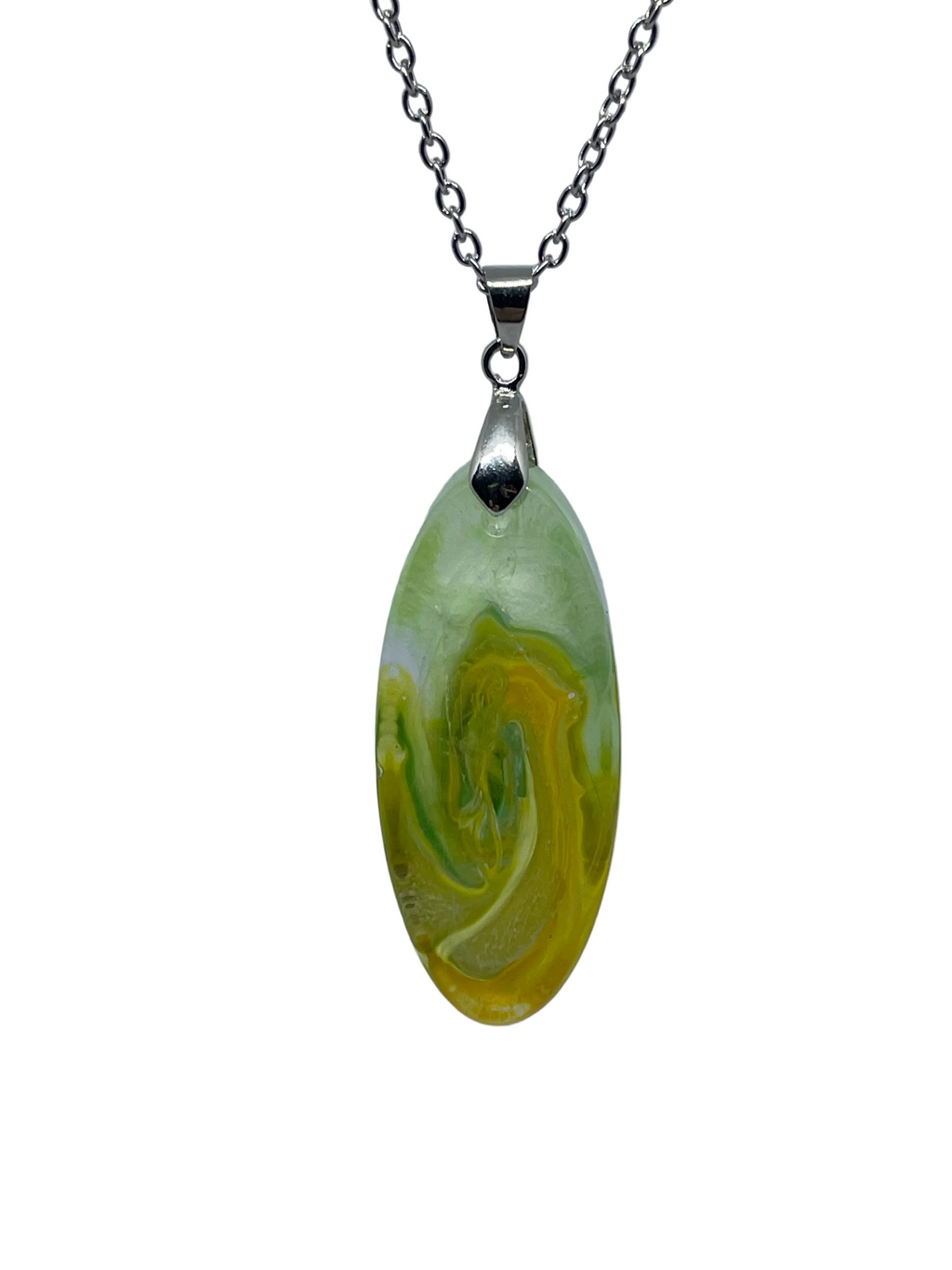 Marbled green and yellow pendant on a silver chain against a gray background