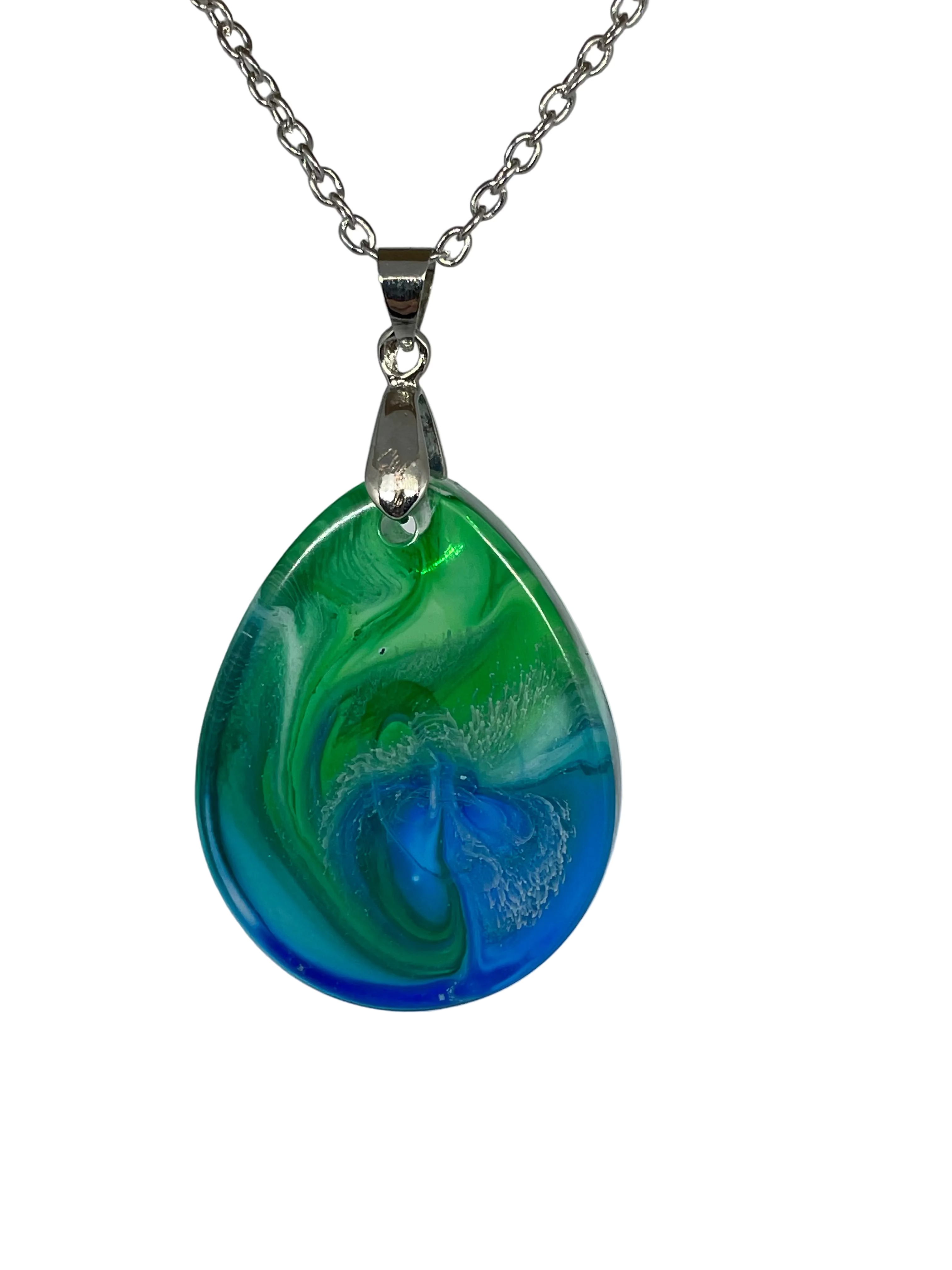 Teardrop-shaped pendant with blue and green swirl design on a silver chain against a gray background