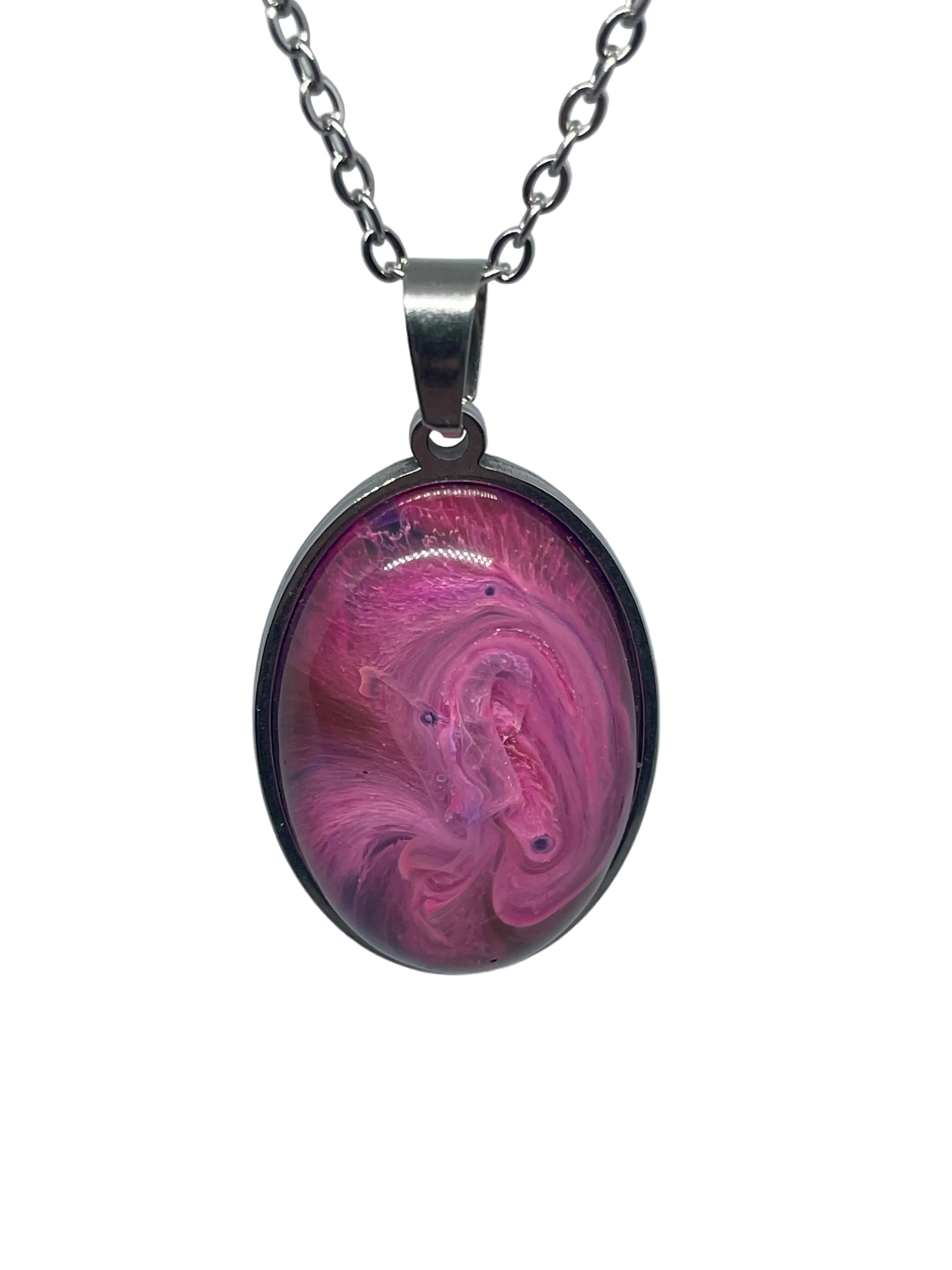 Pink and purple swirl pendant on a silver chain against a gray background