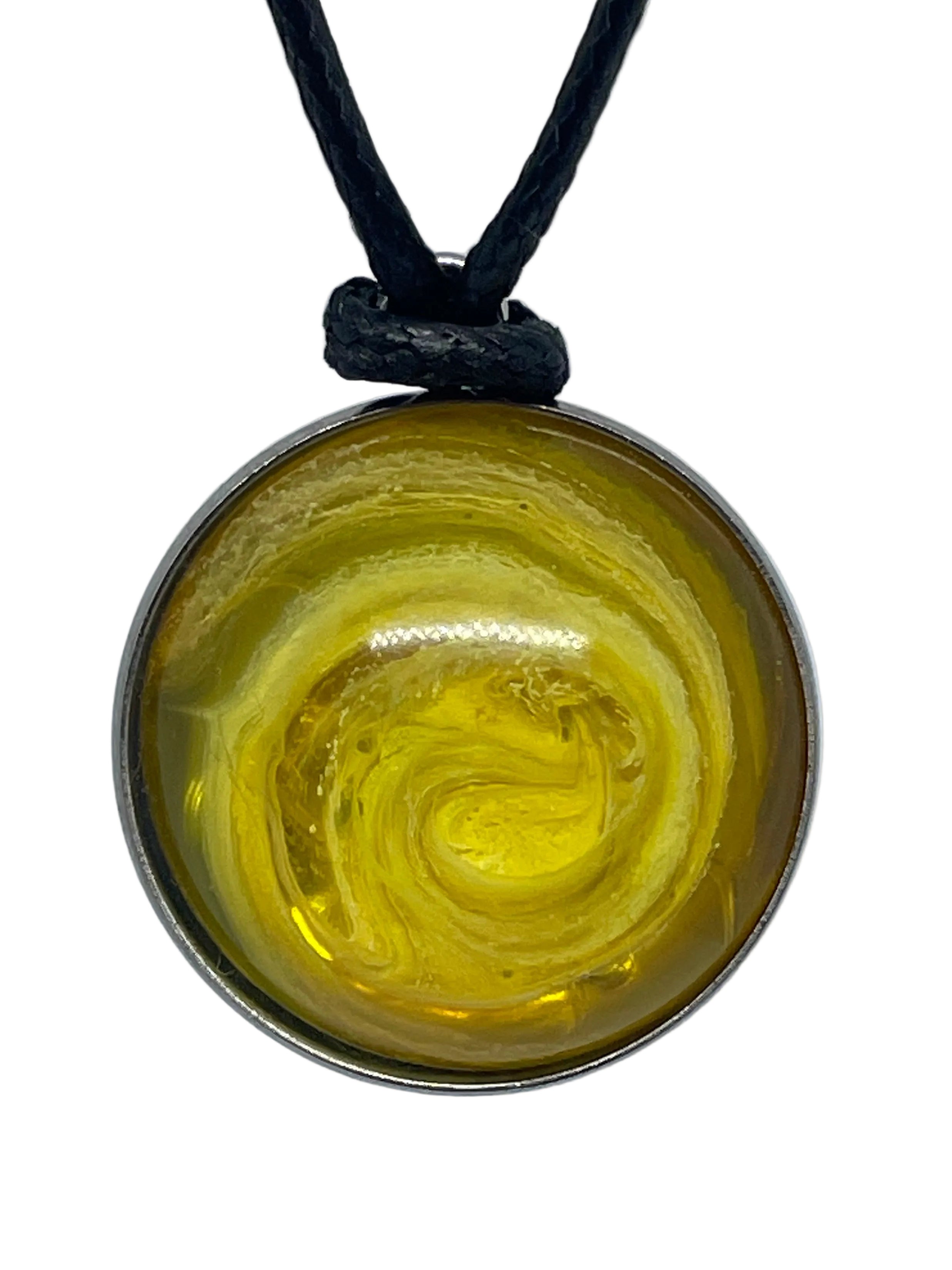 Round pendant with yellow swirl design on a black cord against a white background